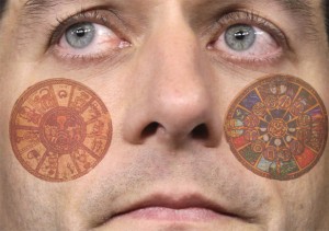 Paul Ryan closeup with apparent tattoos of zodiacs on his cheeks