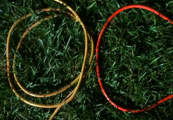 "OC" spelled out by extension cords on grass.