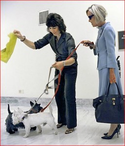 Amy Porter with two dogs and a plastic bag