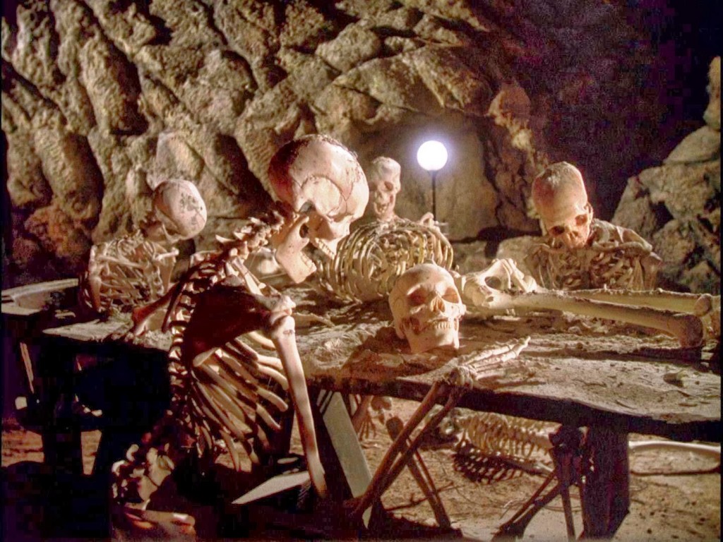 Skeletons at table