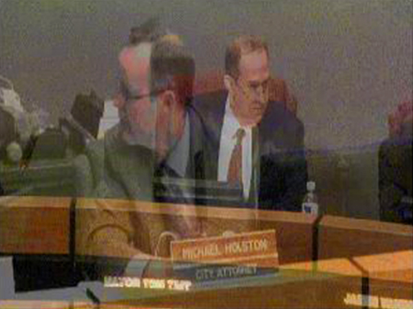 Not a Photoshop, but a frame with a fade from the Counci's own video. Not much conflict between these two that night.