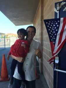 Voting last November, with his granddaughter Alejandra.