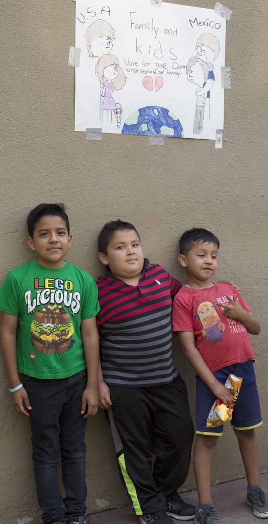 boys and family sign