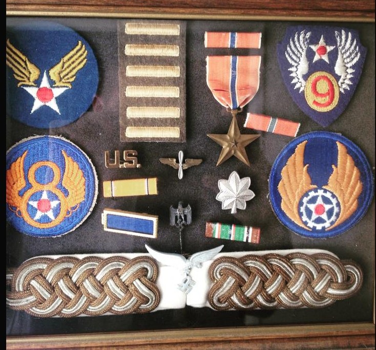 Luis Cardenas' award box. The lower epaulettes and pin are those of a Nazi. officer who was 10 minutes ahead of his unit. The Nazi’s had taken over a French farmhouse. He was given orders to search out Nazi info before he was sent stateside. European African Middle Eastern Service Medal, American Theater Service Medal, American Defense Service Medal, World War II Victory Medal, Bronze Star Medal.