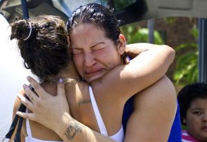 Theresa comforts another bereaved mother.